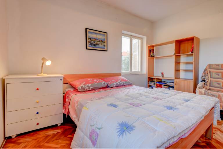 The apartments consists of two bedrooms, a bathroom, a kitchen and a living room — photo 5