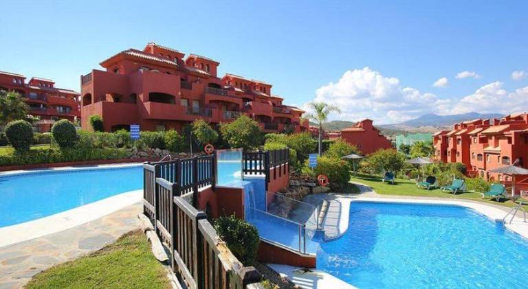 Holiday apartment with patio, private pool & garden in Estepona