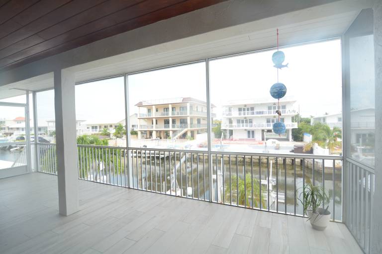Beautiful Canal front Home with Above Ground Pool, Dock and Fish Cleaning Station — photo 5