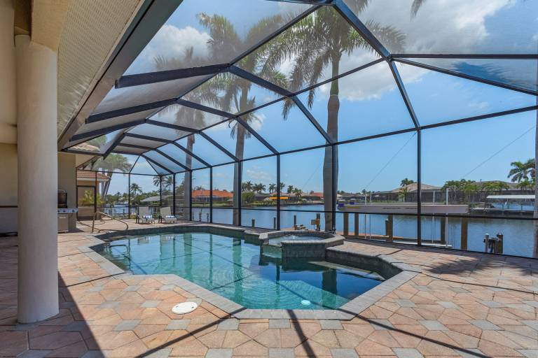 Heated Pool & Spa with Intersecting Canal View - Villa Viewtopia - Roelens in Cape Coral, FL