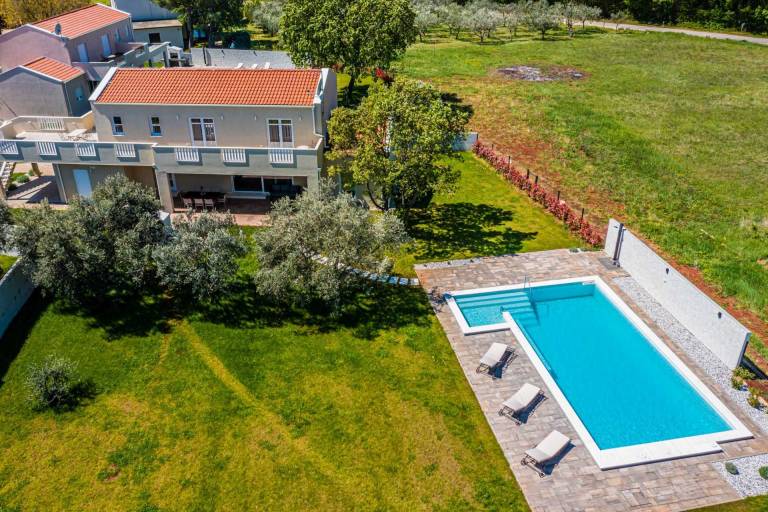 Villa with garden, sauna & BBQ | Pool view in Umag