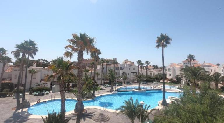 Apartment with yard, pool & patio in Roquetas de Mar