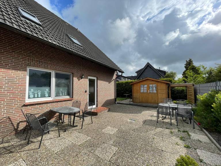 Child-friendly pleasant holiday apartment with garden, sauna & patio | Pets allowed in Wangerland