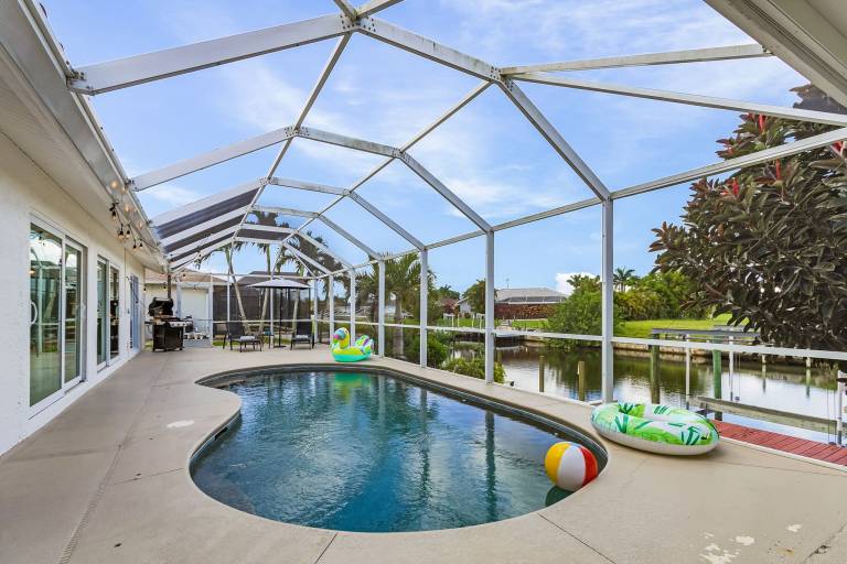Vacation home with grill & private pool | Water view in Cape Coral, FL