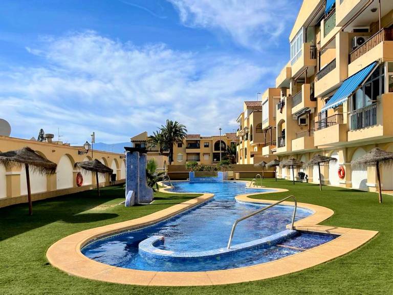Charming holiday apartment with yard, patio & pool | Next to the beach | Pet-friendly in Roquetas de Mar