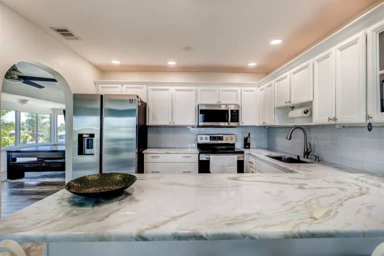 Gone Coastal Expansive Waterfront Pool Home — photo 3