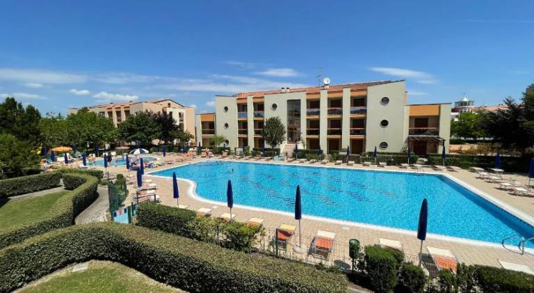 Apartment with pool & patio in Caorle