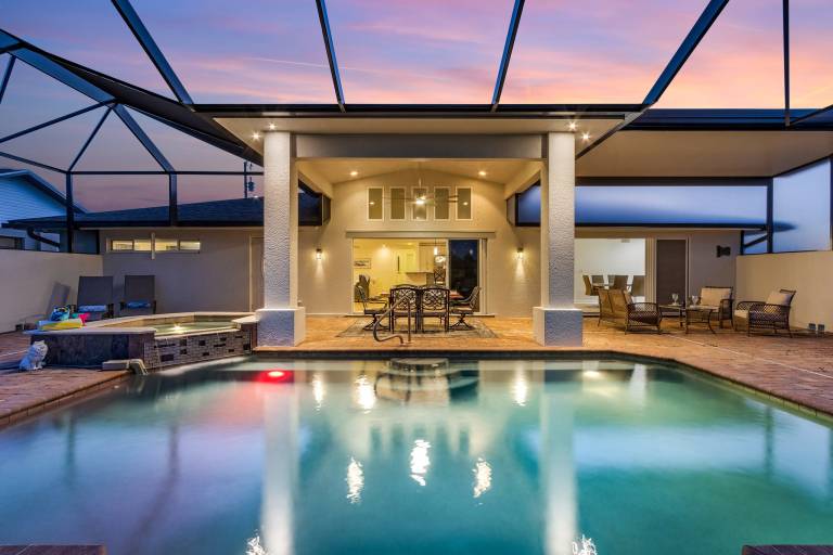 Vacation home with hot tub, grill & private pool | Water view in Cape Coral, FL