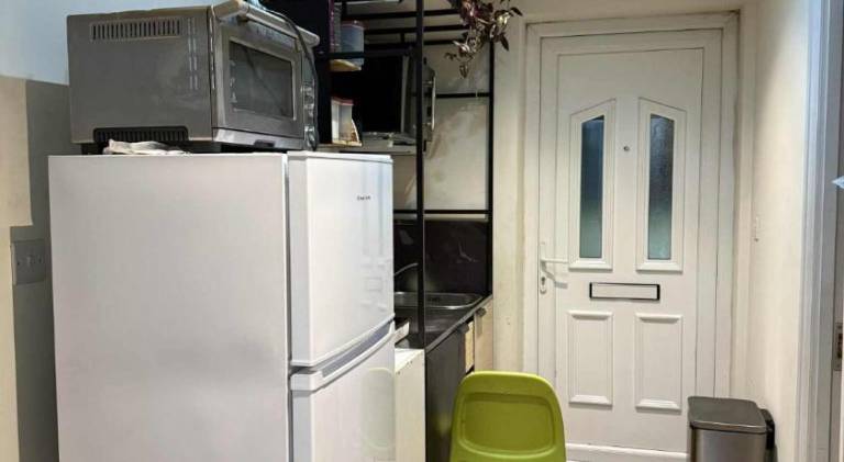 Private guest suite inside a family home with own entrance, kitchen, and bathroom — photo 3