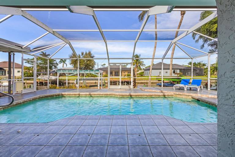 Private Beach, Heated Pool, Kayaks, & Pool Table - Villa Las Palmas - Roelens Vacations in Cape Coral, FL