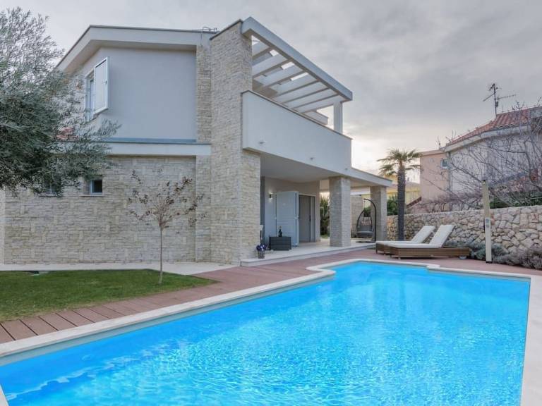 Vacation home with patio, private pool & yard in Novalja