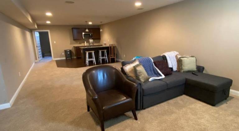 Private basement bedroom with private bathroom, kitchen, and living room with large screen televisio — photo 3