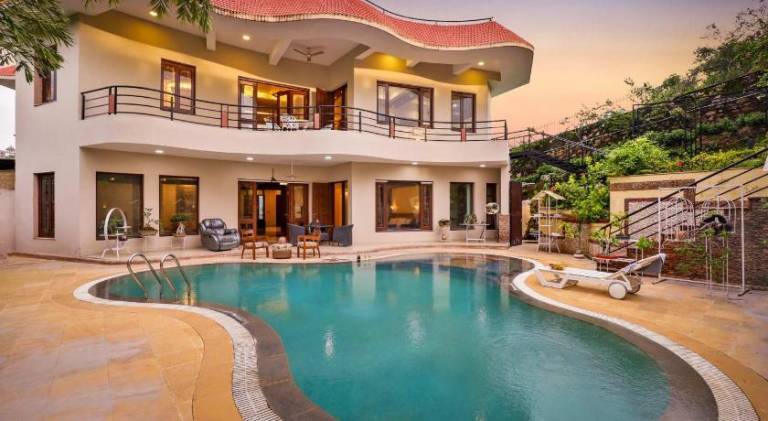 StayVista s Prakriti Farms Mountain View Villa with Outdoor Pool Deck & Lawn featuring a Gazebo