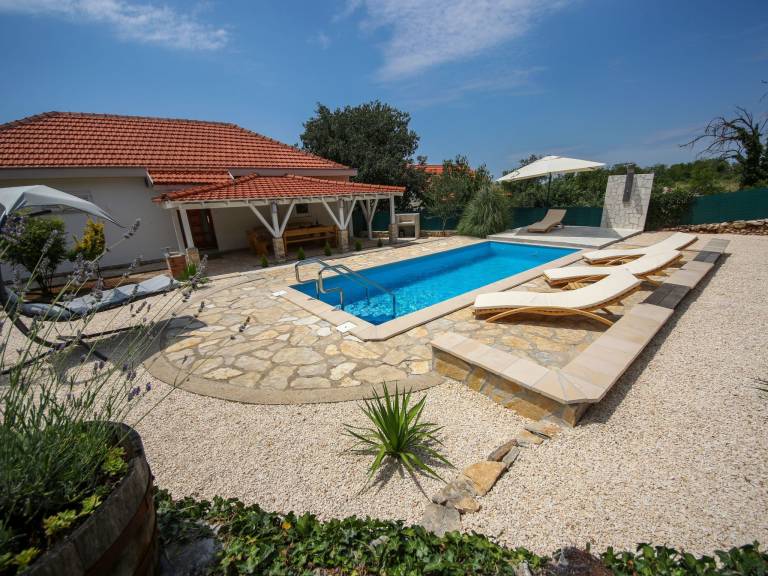 Vacation home with yard, patio & private pool in Sibenik