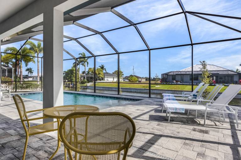 Pool overlooking canal, Outdoor Grilling station - Villa Sand Dollar Siesta — photo 2