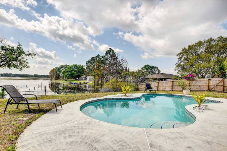 Screened Porch Waterfront Home in Deltona