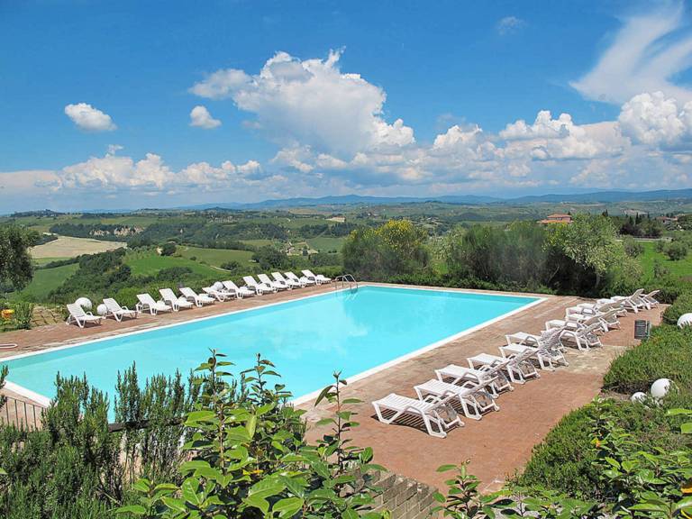 Family-oriented nice holiday apartment with patio, pool & BBQ | Garden view | Pets are welcome in Asciano