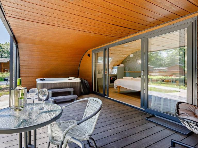 Pleasant lodge with patio & hot tub | Water view | Pet-friendly — photo 2