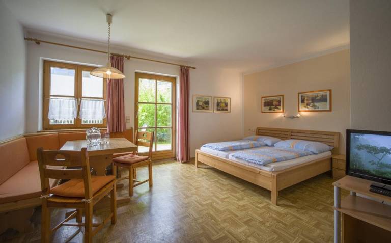 Holiday apartment with patio & yard | Garden view in Walchsee
