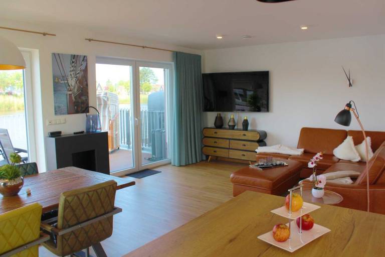 Ferienhaus Seeperle Traumblick: Ihr Rückzugsort am Fluss in Harlesiel in Wittmund