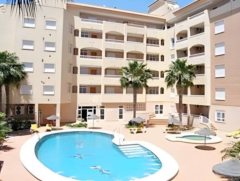 Apartment with terrace, pool & garden in Roquetas de Mar