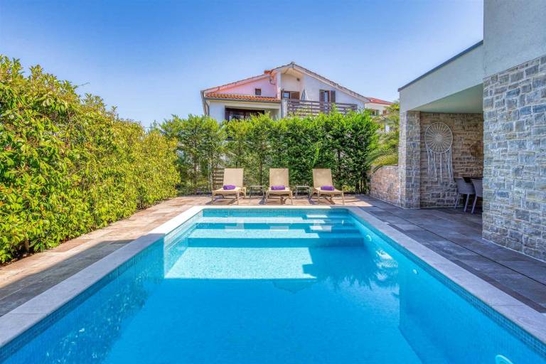 Holiday apartment with pool, yard & terrace | Pool view — photo 2