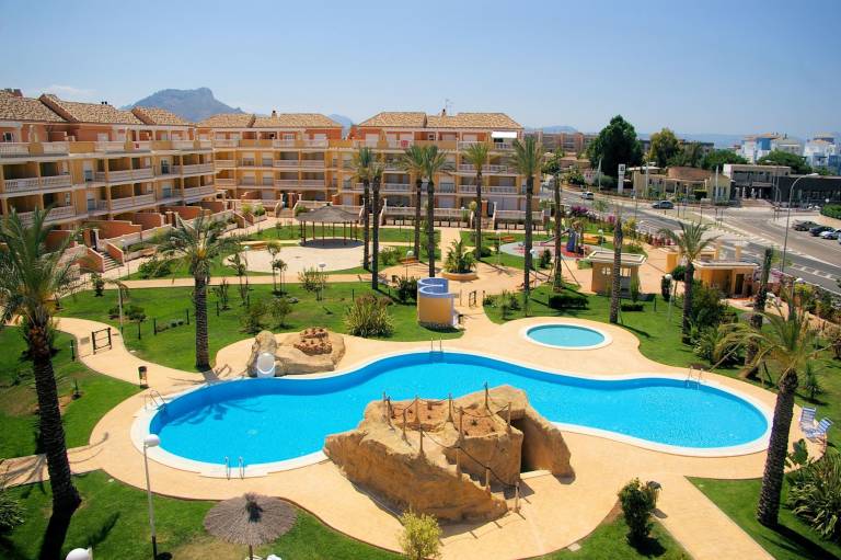 Child-friendly wonderful holiday apartment with patio, yard & pool | Next to the beach | Pet-friendly in Denia