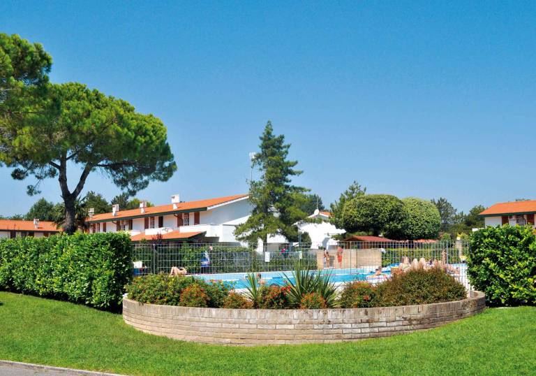 Apartment with terrace, pool & yard in Bibione