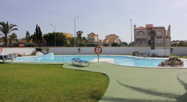 Holiday apartment with yard, terrace & pool in Roquetas de Mar