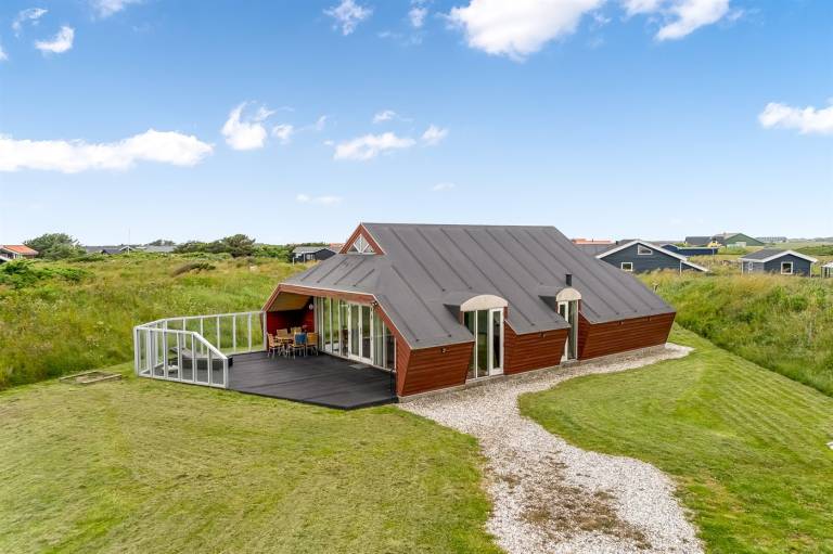 Vacation home with grill, sauna & hot tub in Lokken