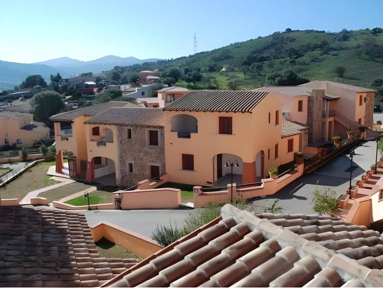 Serviced apartment with patio, pool & yard | Pets allowed in Budoni