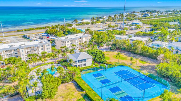 Ocean View Duplex Penthouse Retreat amenities: Tennis court, heated Pool — photo 5
