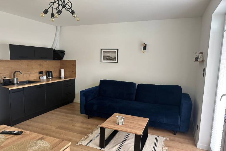 Family-oriented wonderful holiday apartment with garden & terrace | Beach nearby | Dogs allowed in Koszalin