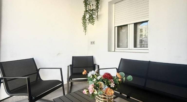 Holiday apartment with patio, pool & yard in Torremolinos