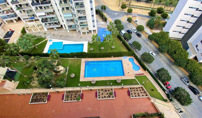 Holiday apartment with patio, yard & pool in Benidorm