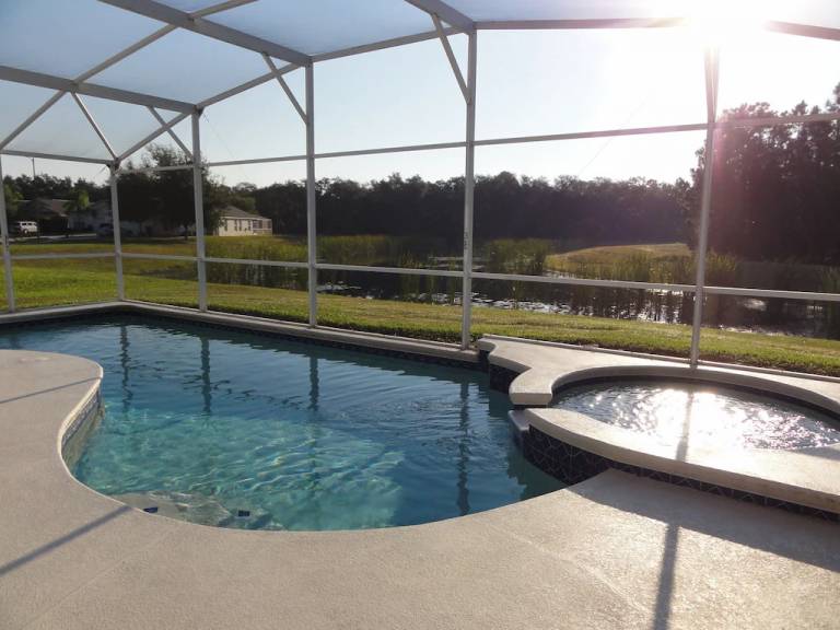 Family-oriented charming villa with grill, hot tub & private pool | Lake view | Dogs allowed in Osceola, FL