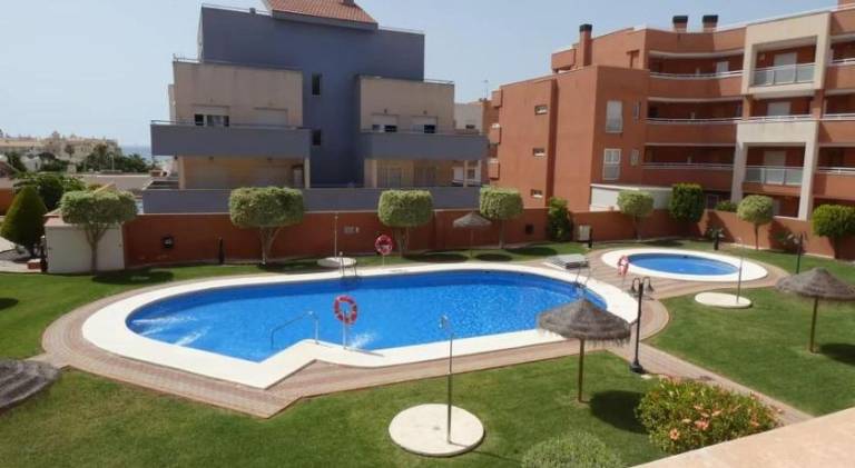 Apartment with pool, yard & patio in Roquetas de Mar
