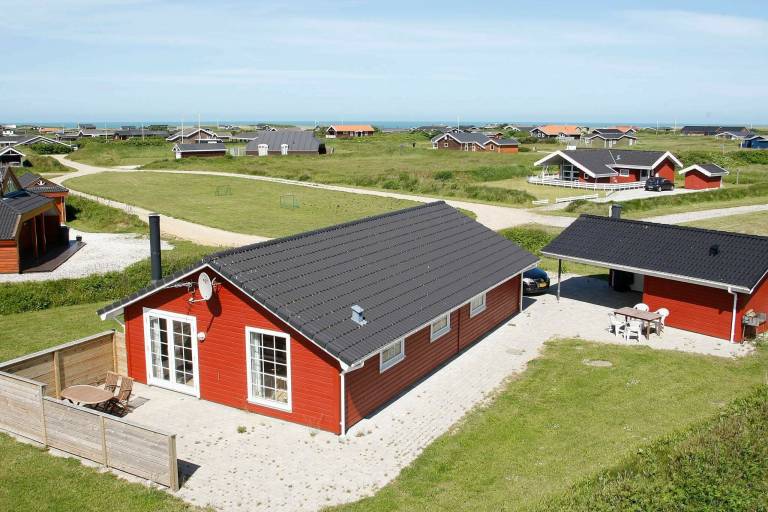 Vacation home with hot tub, terrace & sauna in Lokken