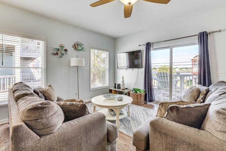 Carolina Beach Condo with Deck: Steps to Shore! in Carolina Beach, NC