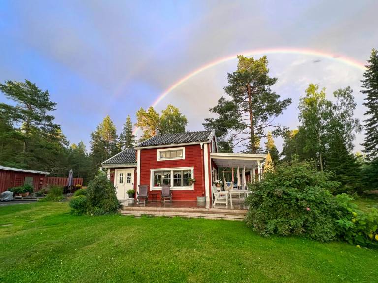 18th-century timber house by sea bay near Umeå in Umea