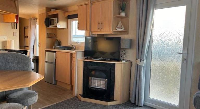 Promenade park 8 Berth caravan next to the beach entrance, WIFI included — photo 2