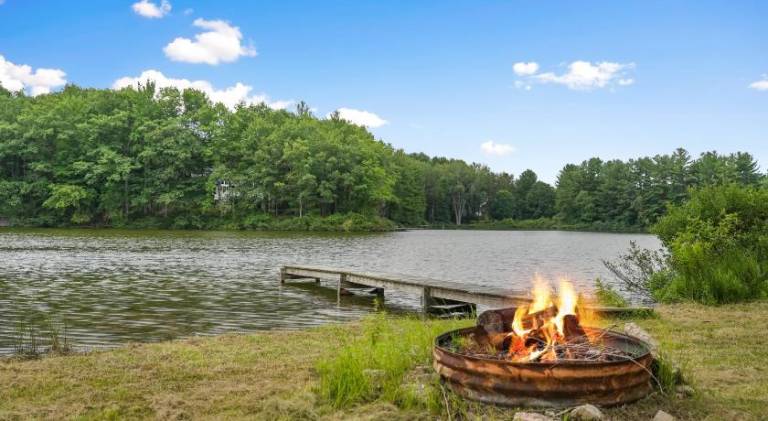 LAKEFRONT PARADISE 4 bedroom Home w direct lake access, Pets OK in Traverse City, MI