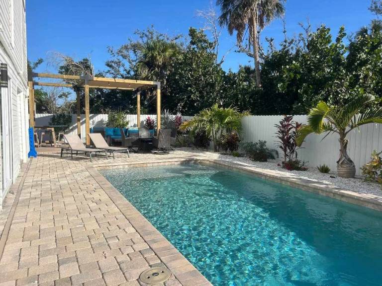Children-friendly pleasant vacation home with heated pool, patio & yard | Water view | Close to the beach | Pet-friendly in Fort Myers Beach, FL