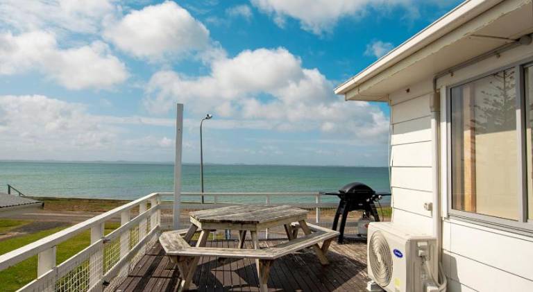 Stunning beachfront bach! — photo 3