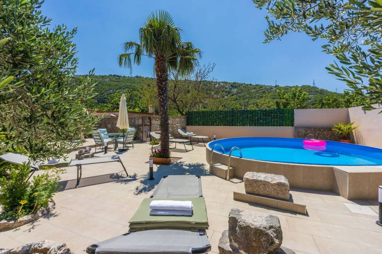 Vacation home with barbeque, garden & private pool in Crikvenica