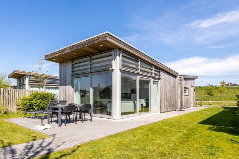 Chalet with yard, patio & heated pool in Kamperland