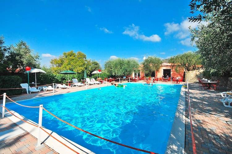Holiday apartment with patio & pool in Imperia