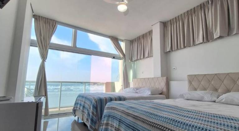 Suites Pitangueiras - POUSADA FRENTE MAR in Guarujá