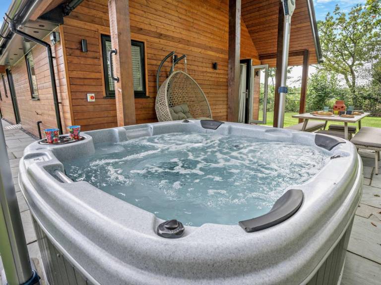 Lodge with yard, patio & hot tub | Pets are welcome — photo 3