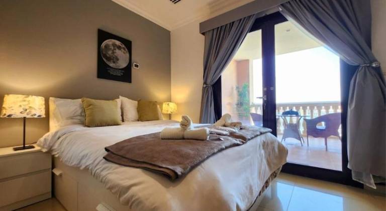 Holiday apartment with patio, garden & pool in Doha